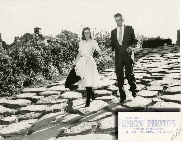 Book #139446] Nicholas Ray and Betty Utey on the stones in Rome (Original press photograph)....