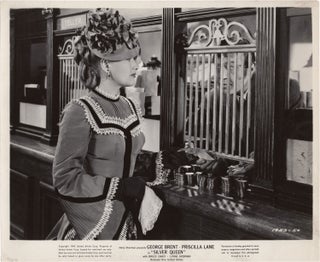 Book #140525] Silver Queen (Original photograph from the 1942 film). Priscilla Lane George Brent,...