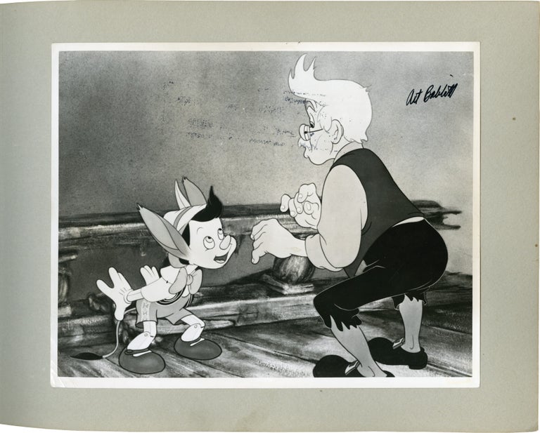 Album of lobby cards and photos from 30 animated films, signed by key animators