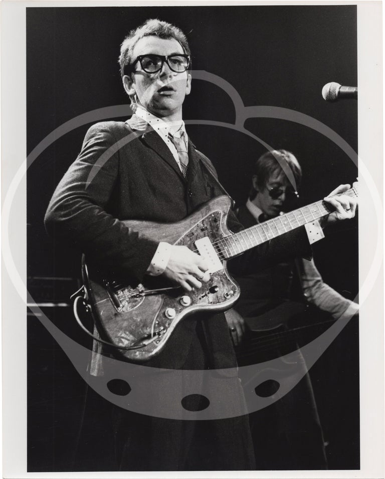 [Book #147940] Collection of eight original photographs of Elvis Costello and the Attractions in concert, circa 1970s. Elvis Costello, Duana LeMay, subject, photographer.