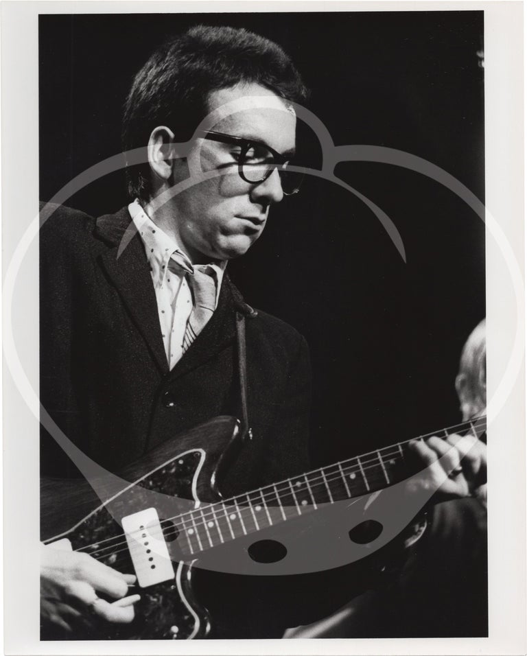 Eight original photographs of Elvis Costello and the Attractions in concert, circa 1970s