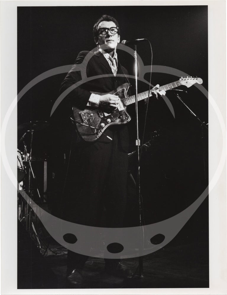 Eight original photographs of Elvis Costello and the Attractions in concert, circa 1970s