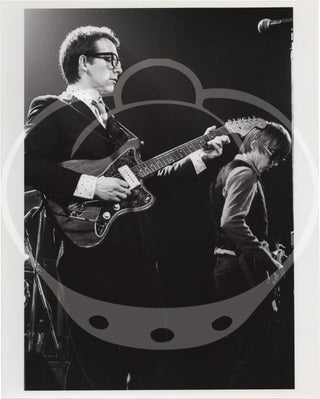 Collection of eight original photographs of Elvis Costello and the Attractions in concert, circa 1970s