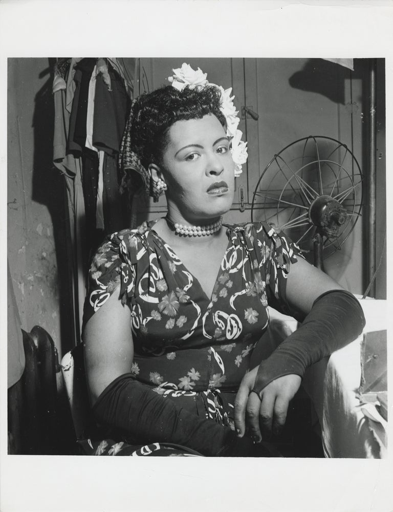 Book #148800] Original photograph of Billie Holiday in her dressing room at the Downbeat Club,...