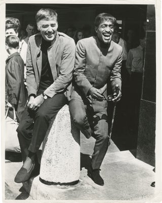 Book #149929] Original photograph of Peter Lawford and Sammy Davis Jr. in London, 1967. Sammy,...