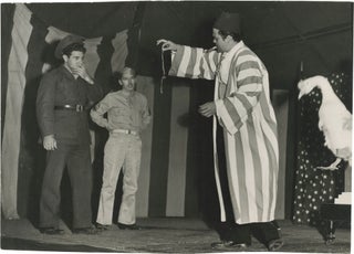 Book #150236] Original photograph of Orson Welles performing a magic show, circa 1943. Orson...