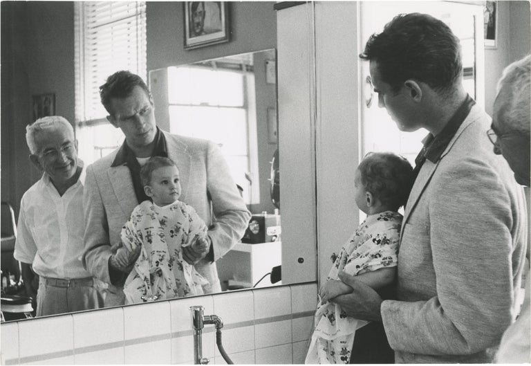 [Book #150316] Original photograph of Charlton Heston and his son Fraser at a barbershop, circa 1956. Fraser Clarke Heston Charlton Heston, Bill Avery, subjects, photographer.