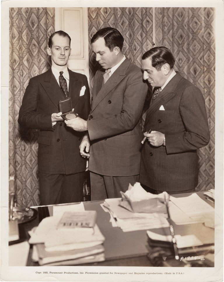 [Book #150964] Original photograph of King Vidor, in the presence of Ernst Lubitsch, being presented the League of Nations first cinema award for his 1934 film "Our Daily Bread," 1935. King Vidor Ernst Lubitsch, Interim French Council Lionel Vasse, subjects.