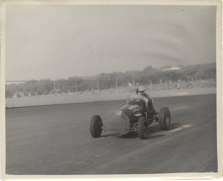 [Book #151268] Archive of 14 vernacular photographs of open wheel races at the Iowa State Fair, circa 1950s. Auto racing.