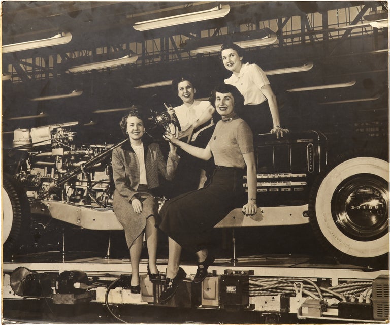 Book #151326] Original oversize photograph of four women employees at a Buick plant, circa 1940s....