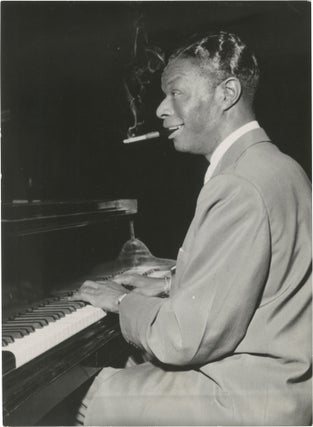 Book #152462] Original photograph of Nat King Cole at the piano, 1956. Nat King Cole, subject