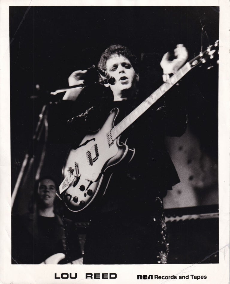 Book #154849] Original photograph of Lou Reed in performance in the UK, opening the Transformer...