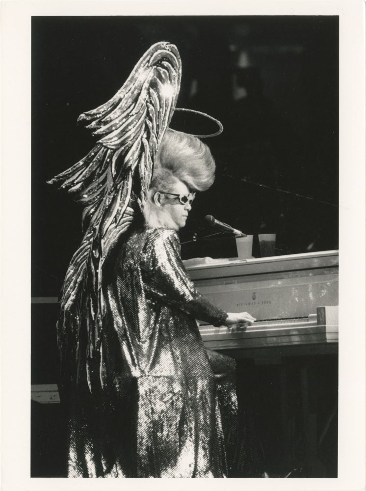 Book #156302] Collection of thirteen original photographs of Elton John, circa 1970s. Elton John,...