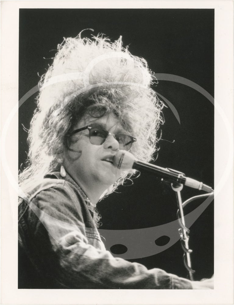 Collection of thirteen original photographs of Elton John, circa 1970s