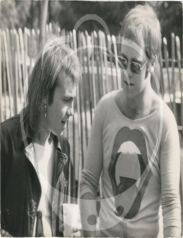 Collection of thirteen original photographs of Elton John, circa 1970s