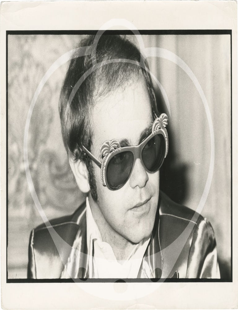 Collection of thirteen original photographs of Elton John, circa 1970s