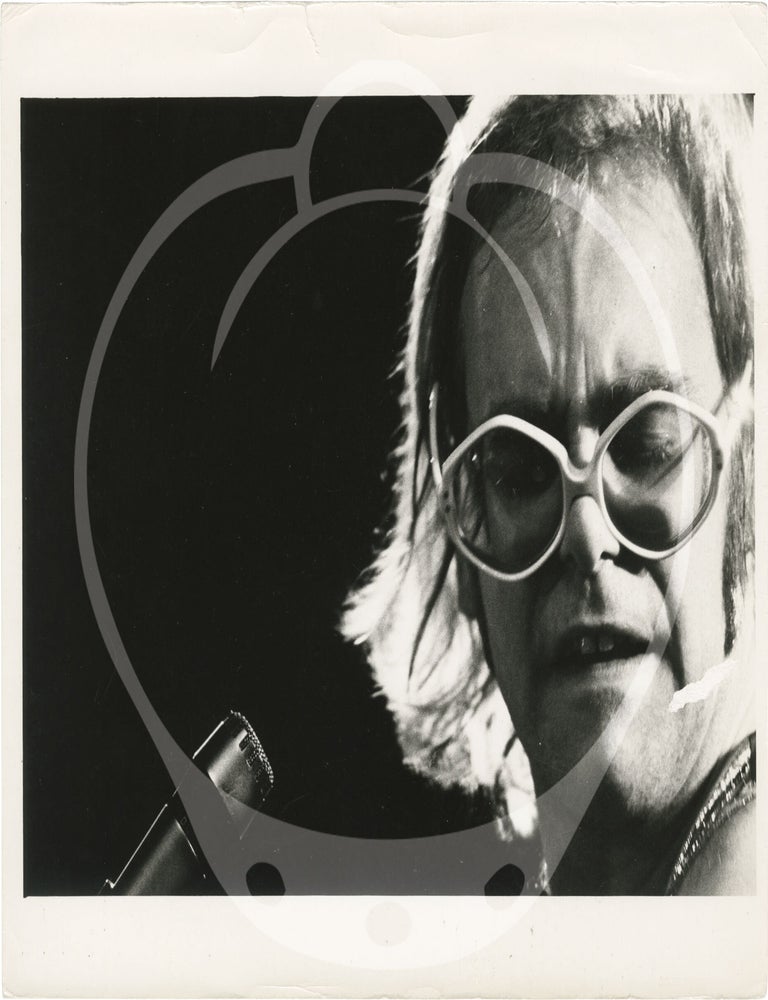 Collection of thirteen original photographs of Elton John, circa 1970s