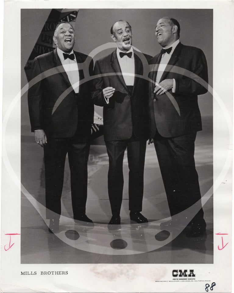Eight original photographs of The Mills Brothers