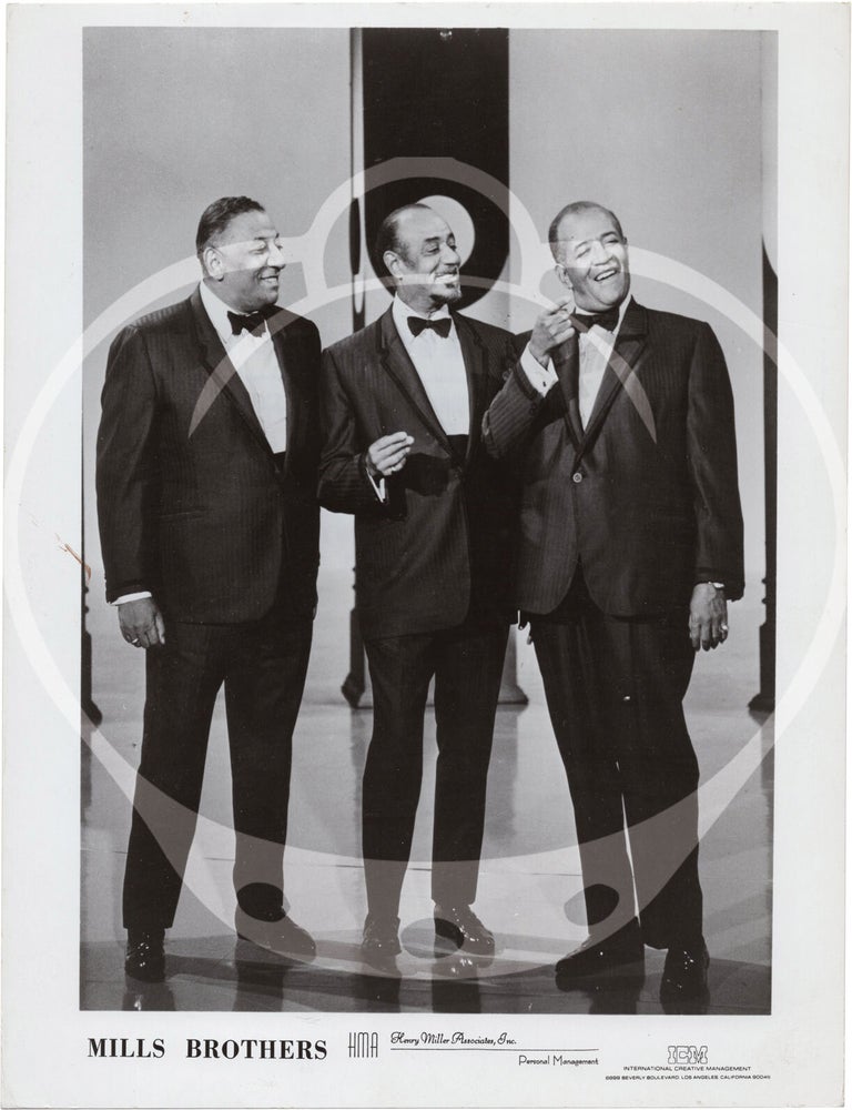 Eight original photographs of The Mills Brothers