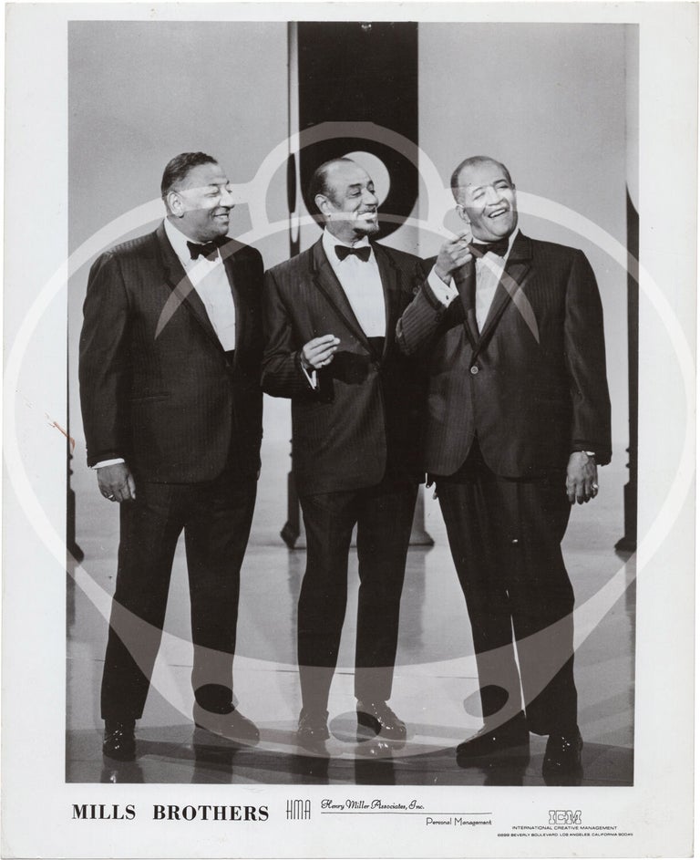 Eight original photographs of The Mills Brothers