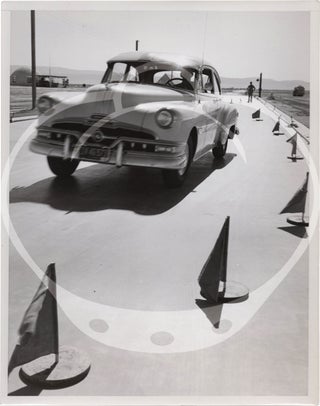 Archive of fifteen original photographs of automobile tire testing by the US Rubber Company, circa 1950s