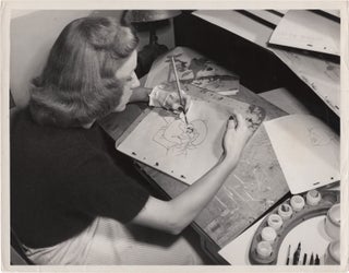 Book #157097] Melody Time (Original photograph of a Disney animator working on a cel for the 1948...