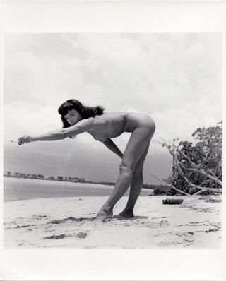 Book #157641] Original photograph of Bettie Page on the beach, 1954. Bettie Page, Bunny Yeager,...