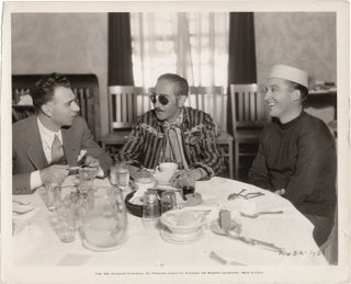 Book #158026] Original photograph of Adolphe Menjou, Bing Crosby, and Wesley Ruggles eating lunch...