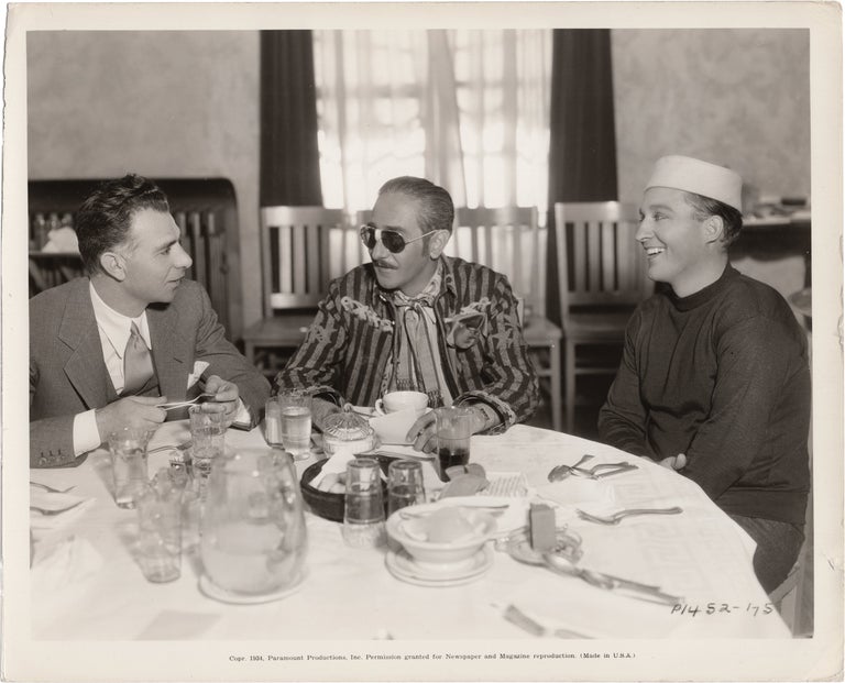 [Book #158026] Original photograph of Adolphe Menjou, Bing Crosby, and Wesley Ruggles eating lunch in the Paramount commissary. Adolphe Menjou Bing Crosby, Wesley Ruggles, subjects.