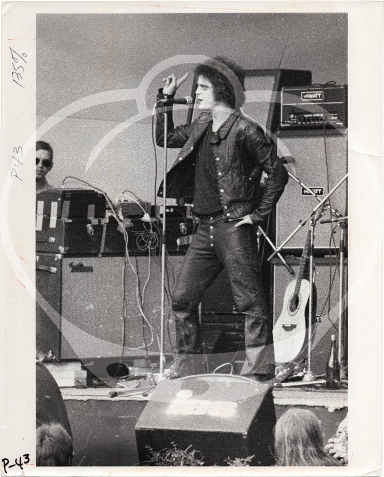 [Book #158134] Original photograph of Lou Reed performing at the Crystal Palace Garden Party, London, 1973, by photographer Chris Walter. Lou Reed, Chris Walter, subject, photographer.