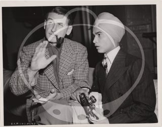 Two original photographs of Sabu talking with John Cromwell while visiting Selznick International in Hollywood