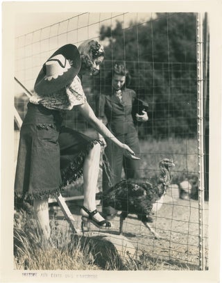 Book #158660] Original photograph of Lucille Ball with a turkey, circa 1940s. Lucille Ball,...
