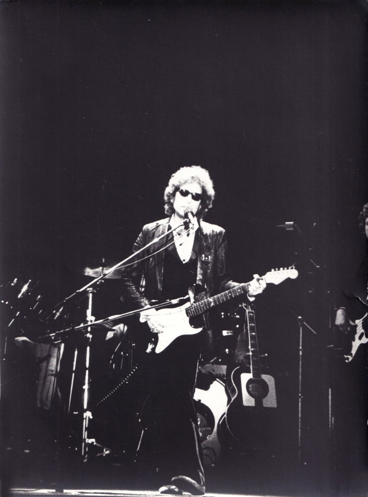 Two original photographs of Bob Dylan performing in Paris, 1978