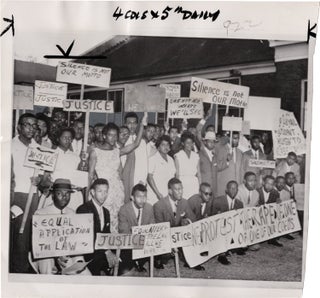 Book #159652] Two original press photographs depicting protests during the Civil Rights Movement....
