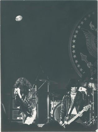 Book #159959] Three original photographs of the Ramones in concert in Paris, 1977. The Ramones,...
