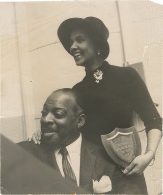 Book #160340] Original photograph of Count Basie and his wife with the 1957 "DownBeat" Critics...