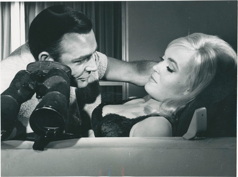 Book #160980] Goldfinger (Two original photographs from the 1964 film). Shirley Eaton Sean...