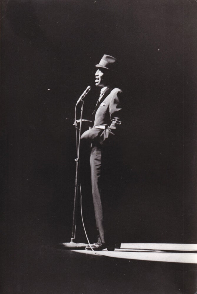 Book #161312] Original photograph of Sammy Davis Jr. performing onstage at the Olympia in Paris,...