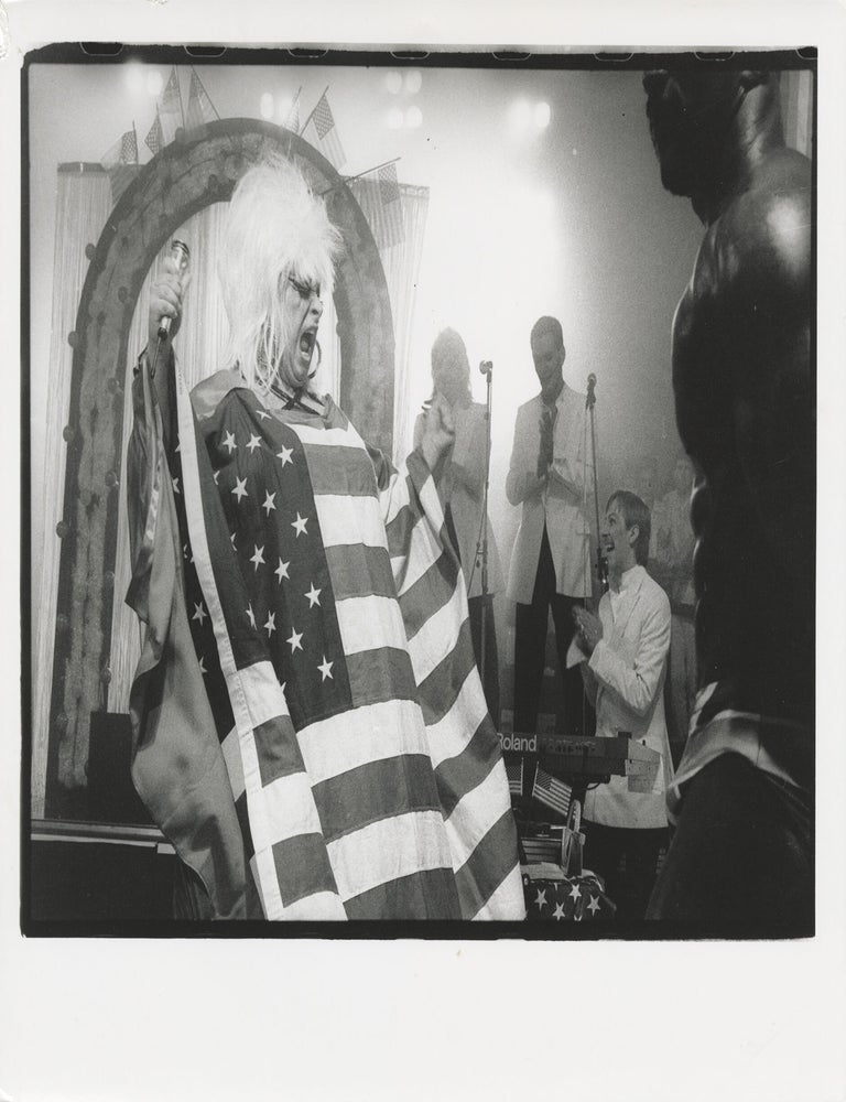 Four original photographs of Divine in performance at the Hippodrome, 1985-1987