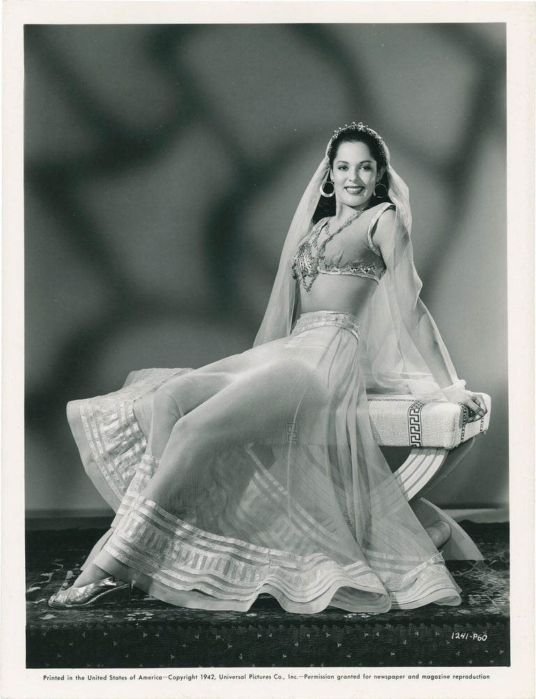 Collection of 13 original publicity photographs of Acquanetta, one inscribed by the actress on the verso