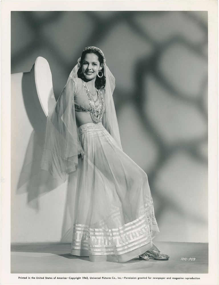 Collection of 13 original publicity photographs of Acquanetta, one inscribed by the actress on the verso