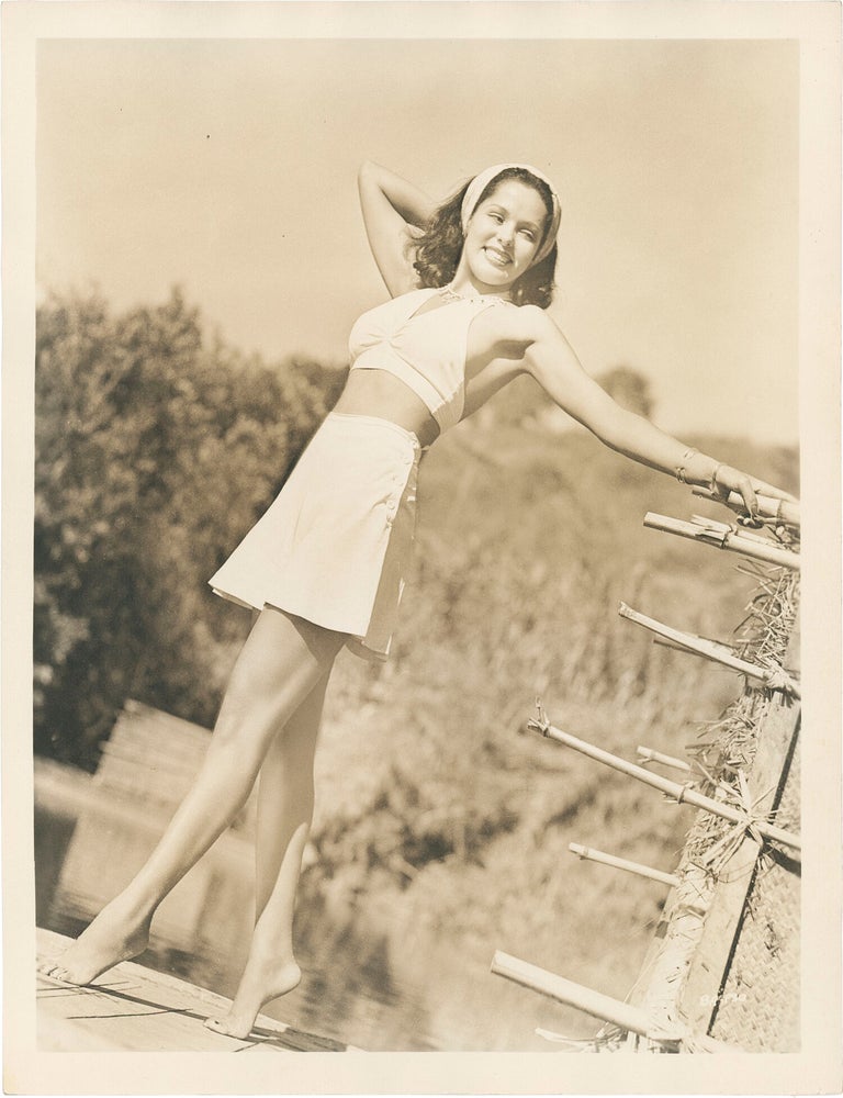 Collection of 13 original publicity photographs of Acquanetta, one inscribed by the actress on the verso