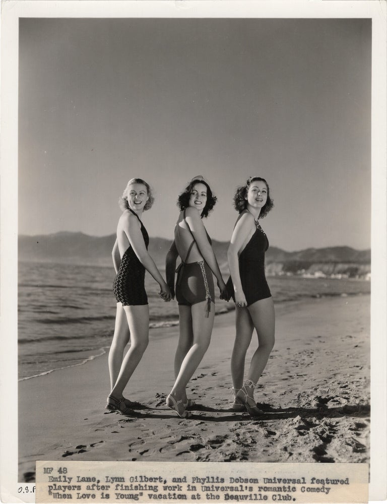 Book #165571] Original photograph of Emily Lane, Lynn Gilbert, and Phyllis Dobson on the beach at...