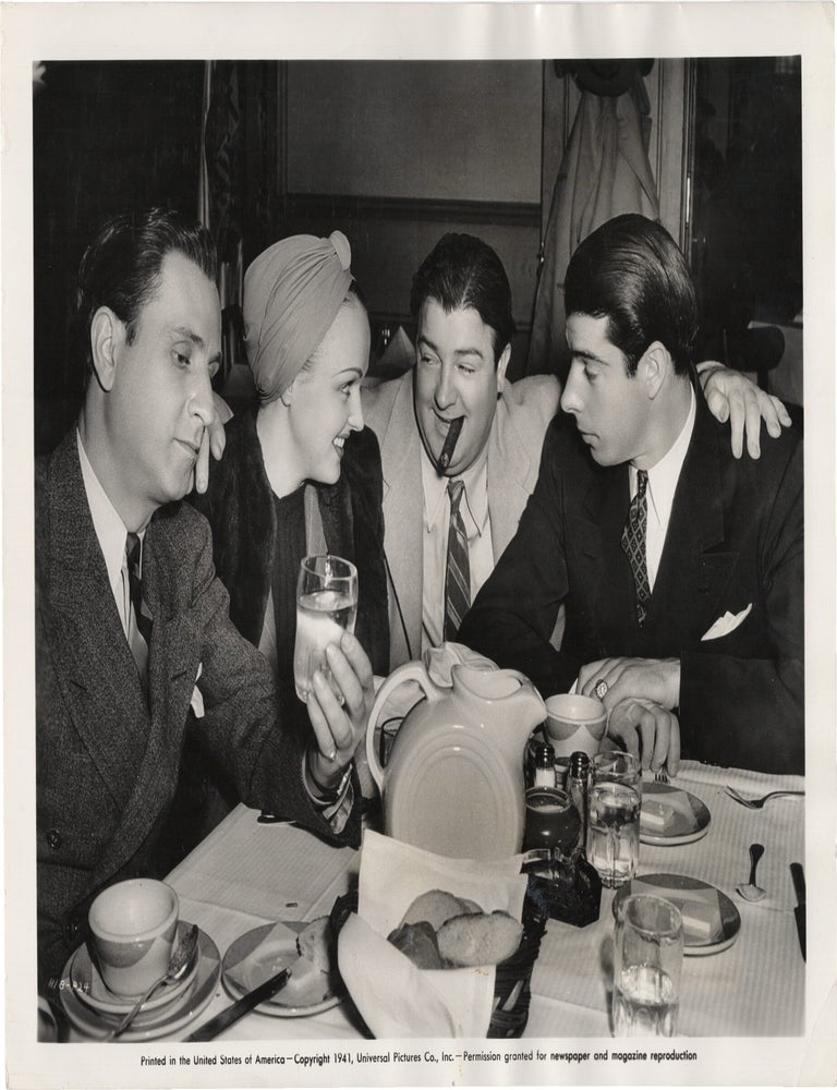Book #165577] Original photograph of Bud Abbott and Lou Costello enjoying a meal with Joe...