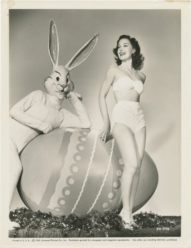 Book #165980] Original publicity photograph of Dorothy Hart and the Easter Bunny. Dorothy Hart,...