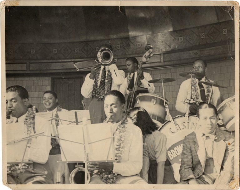Archive of nearly 150 photographs of jazz, blues, and popular music performers, including 50 INSCRIBED photographs, as well as a handful of personal photographs, belonging to jazz drummer and bandleader "Monk" McFay, circa 1930s through 1950s
