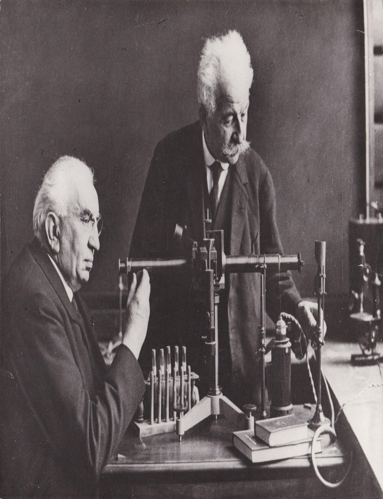 Vintage photograph of Auguste and Louis Lumi&egrave;re in their laboratory, taken in 1929 and struck...