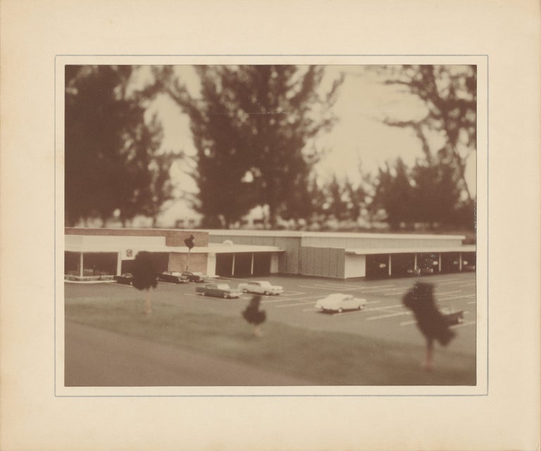 Six original photographs of a miniature model of a Cadillac dealership