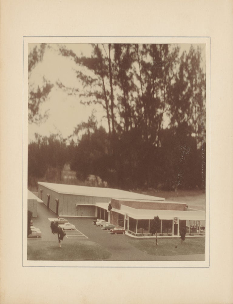 Six original photographs of a miniature model of a Cadillac dealership