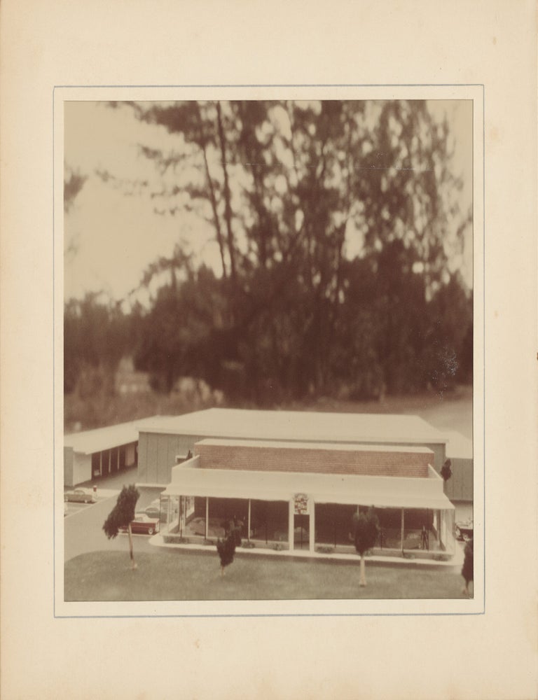 Six original photographs of a miniature model of a Cadillac dealership